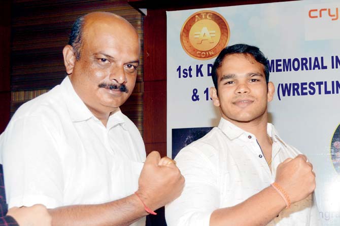 Ranjit Jadhav (left) and wrestler Narsingh Yadav during a press conference to announce the biopic on late Olympics bronze-winning Indian wrestler KD Jadhav in Juhu yesterday. Pic /Satej Shinde