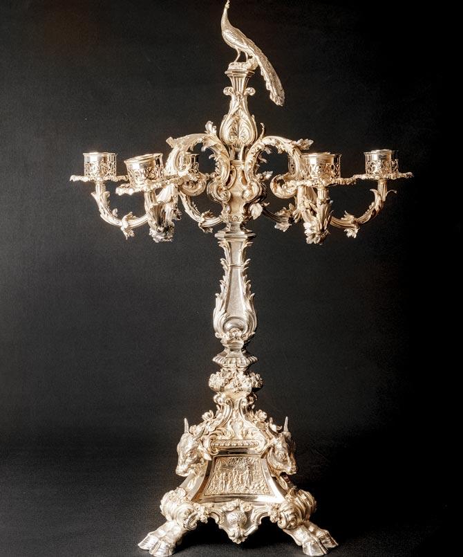 A candelabra with bull detailing Pics/Pundole
