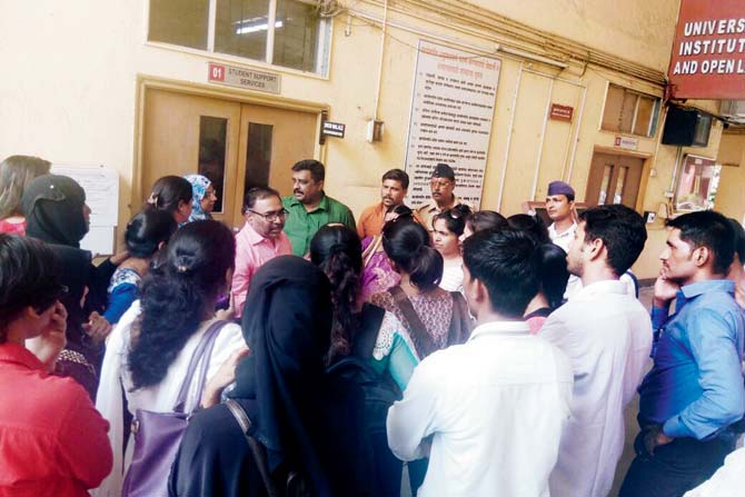 Students protest outside the Institute of Distance and Open Learning office in Kalina