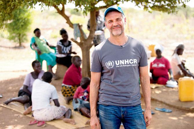 UNHCR Goodwill Ambassador Khaled Hosseini at a refugee camp in Uganda. Pic/Jordi Matas, UNHCR