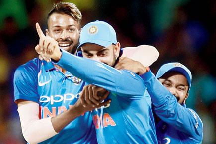 Virat Kohli has a broad smile on his face, and the Indian bowlers are the reason