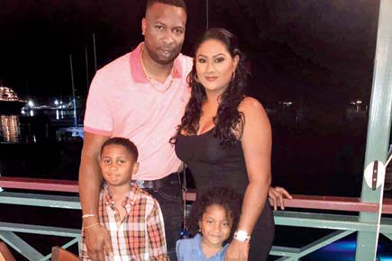 Cute and candid! Kieron Pollard, wife Jenna and kids pose for a photograph