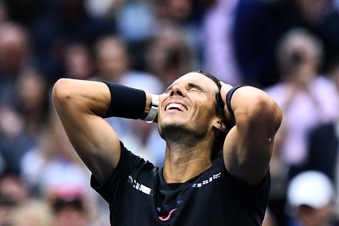 Rafael Nadal celebrates after defeating South Africa