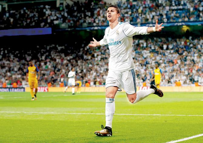 Cristiano Ronaldo after scoring his first goal for Real against APOEL Nicosia in Madrid on Wednesday. Pic/Getty Images