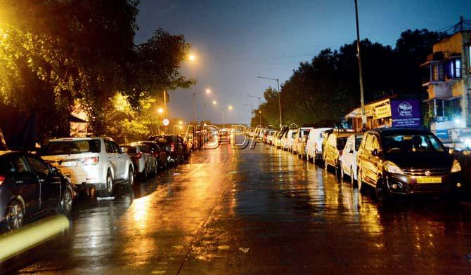 Several motorists parked their cars on Milan Subway bridge, Santacruz, last night to avoid the water logged road ahead