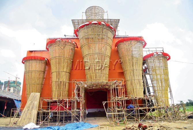 The bamboo facade of the pandal, created by artists brought in from West Bengal rises up to nearly 100 feet