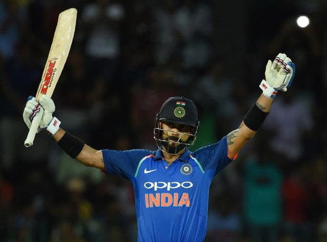 Indian cricket captain Virat Kohli celebrates after scoring a century (100 runs) during the final one day international (ODI) cricket match between Sri Lanka and India at The R. Premadasa Stadium in Colombo. Pic/AFP