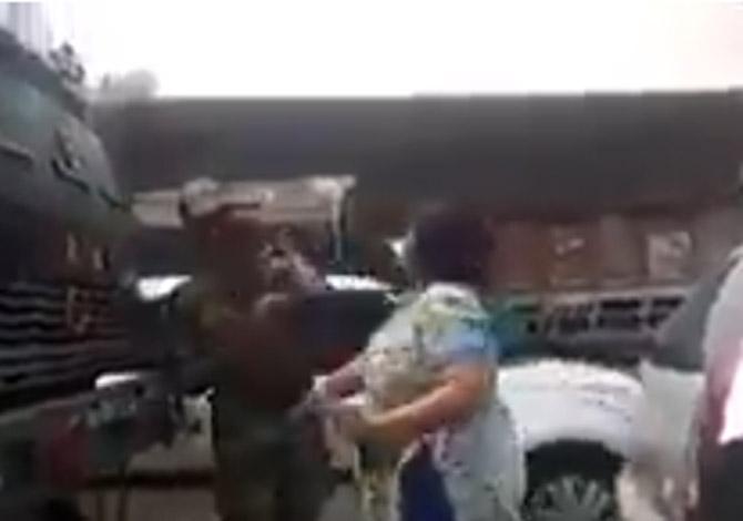 Woman slapping soldier
