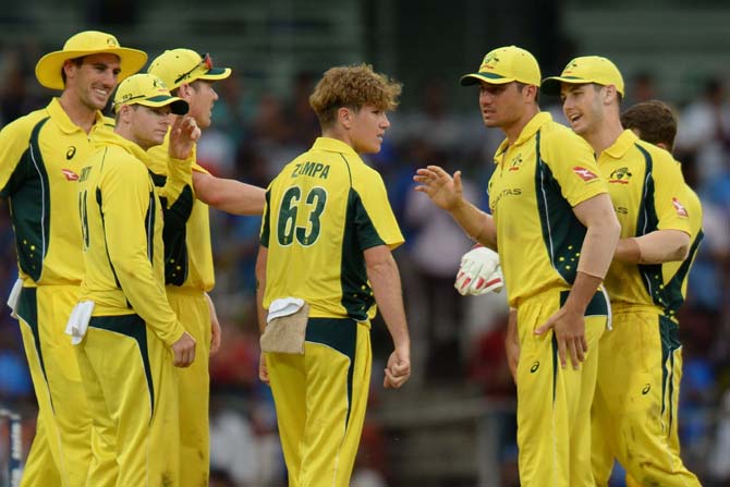 Adam Zampa celebrates a wicket along with teammates. Pic/ AFP