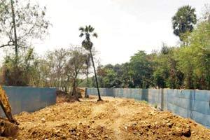 BMC builds wall of Oshiwars river inside Aarey colont, despite NGT warning