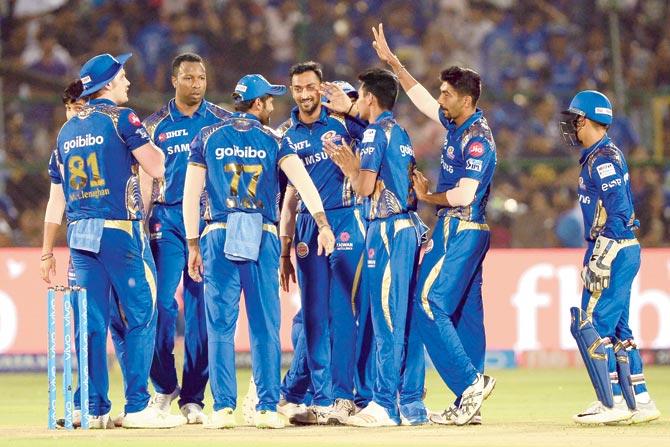 Mumbai players celebrate the wicket of Rahul Tripathi during their match against Rajasthan in Jaipur on Sunday. Pic/AFP