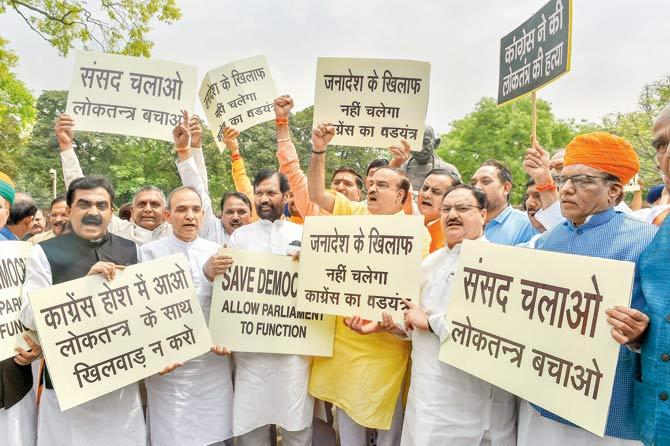 Union Parliamentary Affairs Minister Ananth Kumar, Union ministers Ramvilas Paswan, J P Nadda and other BJP MPs protest against Congress and Opposition parties during the last day of the budget session, at Parliament House. Pic/PTI