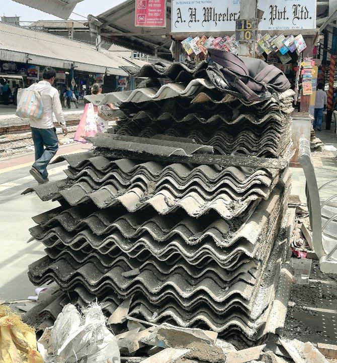 Asbestos sheets piled up at Kurla station, which is getting a new roof made of metal