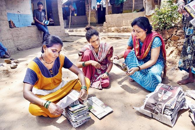 Tribal families in Khambyachapada making paper bags. Pic/Pradeep Dhivar