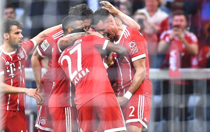 Players of FC Bayern Munich celebrate after the second goal during the German first division Bundesliga football match FC Bayern Munich vs Borussia Moenchengladbach in Munich. Pic/AFP