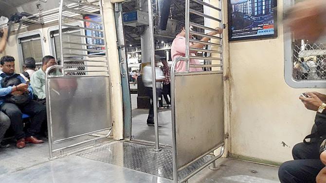 One of the modified coaches with the sets of seats nearest to the door removed for more standing space