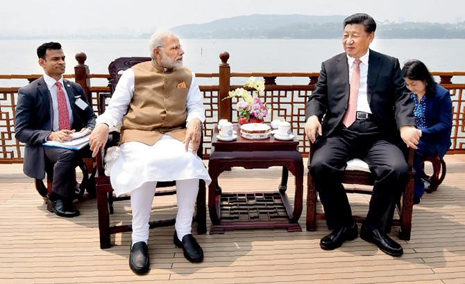 PMâu00c2u0080u00c2u0088Narendra Modi with his Chinese counterpart Xi Jinping. Pic/AFP