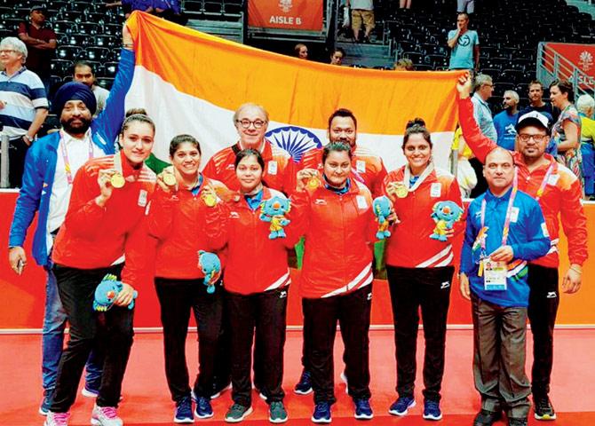 Manika Batra (left) and her teammates in a joyous mood after beating Singapore to clinch a historic gold medal at the Commonwealth Games in Gold Coast, Australia. Pics/PTI