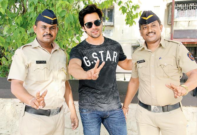 A file photo of Varun Dhawan with officers in Mumbai