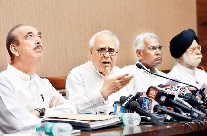 Congress leaders Ghulam Nabi Azad and Kapil Sibal, along with CPI’s D Raja and KTS Tulsi, address the media after opposition parties submitted a notice to initiate impeachment proceedings against CJI Dipak Misra, in New Delhi on Friday. Pic/PTI