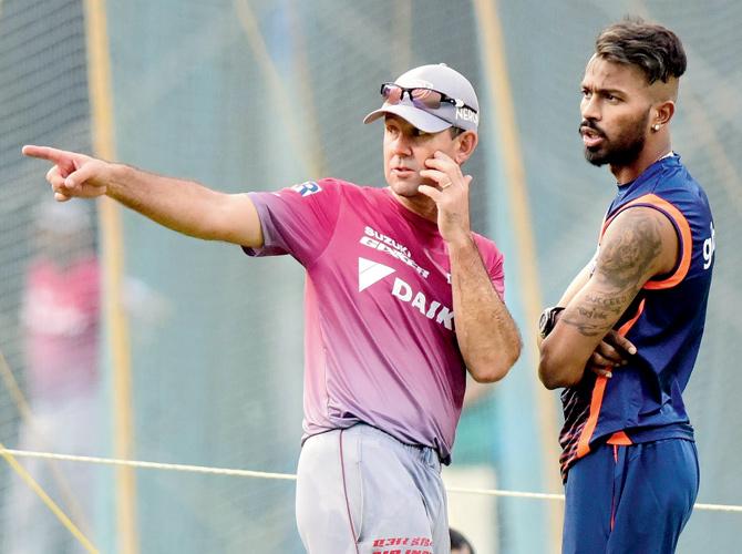 Mumbai all-rounder Hardik Pandya with Delhi coach Ricky Ponting at Wankhede yesterday. Pic/Suresh Karkera