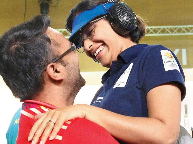 Heena Sidhu celebrates with her husband and coach Ronak Pandit after winning the gold medal in the 25m air pistol event at the Commonwealth Games in Brisbane yesterday. Pic: AP/PTI