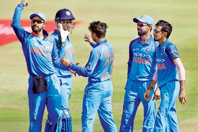 Indian players celebrate a South African wicket during the first ODI at Durban recently. Pic/AFP