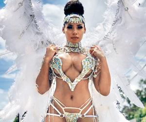 Usain Bolt's fiancee Kasi Bennett flaunts cleavage, curves in carnival outfit