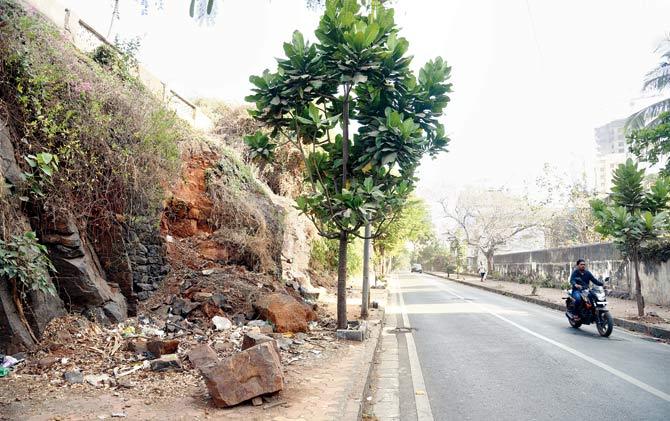 The road adjoining the hilly portion, which poses a risk of landslides