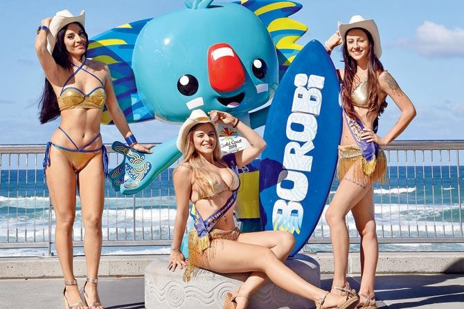 Meter maids posing with the Commonwealth Games mascot at Surfers Paradise on Gold Coast recently. Pic/AFP