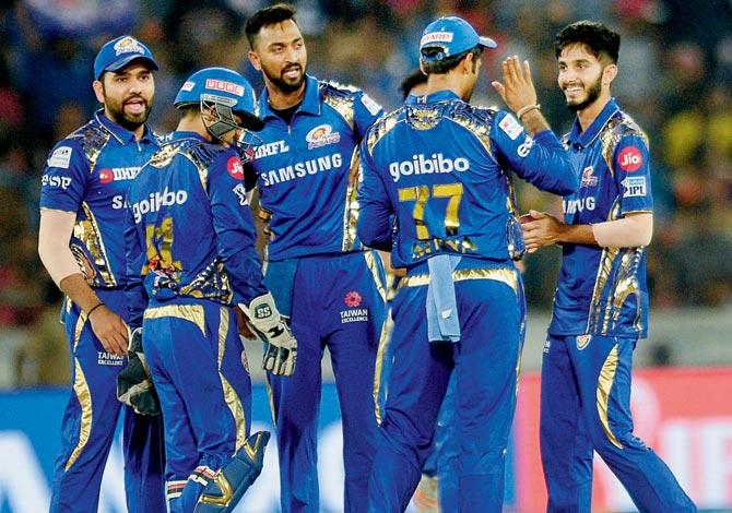 Members of the Mumbai team celebrate the wicket of Hyderabad