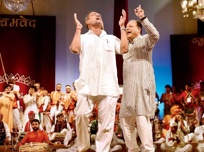 Actor Nana Patekar and professor Waman Kendre dance with artistes from villages at the closing ceremony of the Theatre Olympics at Kamgaar Kalyan Maidan at Elphinstone Road on Sunday. Pic/Bipin Kokate