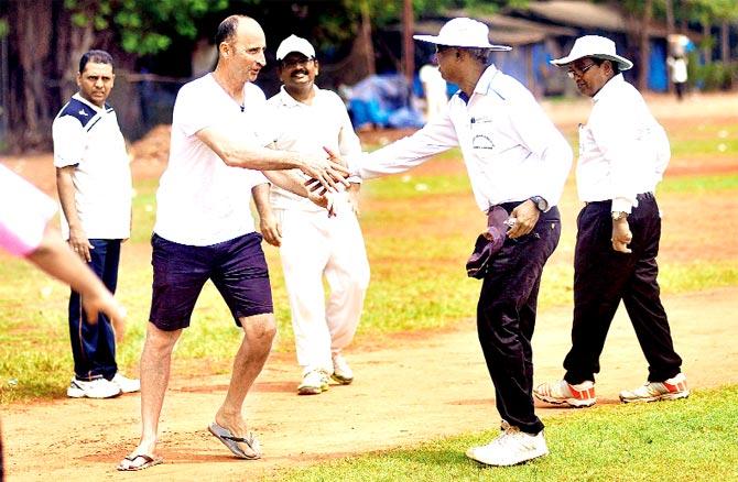 Ex-England captain Nasser Hussain (left) thanks the umpires after participating in a game at Azad Maidan yesterday. Pic/Bipin Kokate