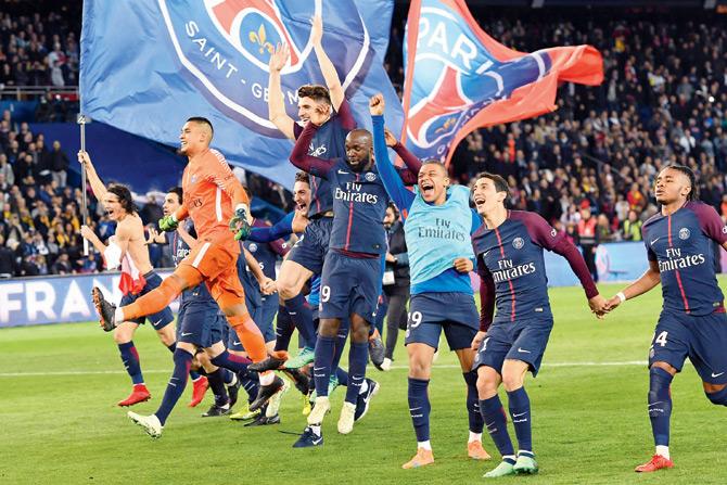 PSG players celebrate after winning the French league on Sunday