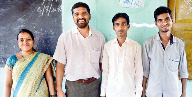 Prahlad with three of the teachers at Vidyankur — Roshana Kathole, Mohan Shanware, and Lavesh Bhoir.