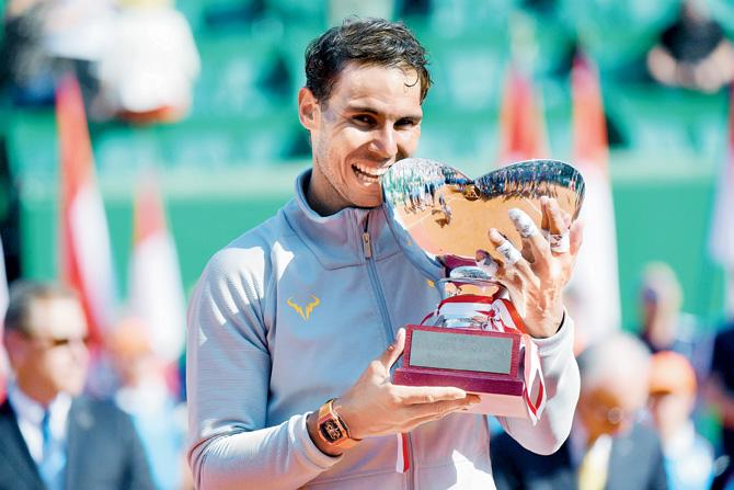 Rafael Nadal with the Monte Carlo Masters trophy yesterday