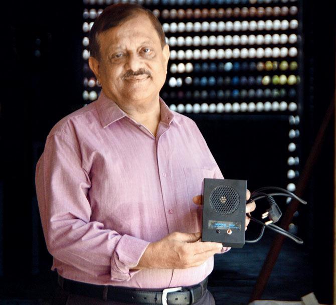 Navin Rohatagi, a partner at Sth Solutions, with their Ultrasonic Rat Repellant, Pic/Satej Shinde