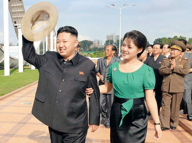 Kim Jong Un (left) with Ri Sol Ju