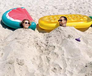 Rio Ferdinand's 'little rats' bury him and girlfriend Kate in Dubai sand