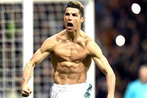Last-gasp Ronaldo penalty takes Real Madrid into Champions League semis