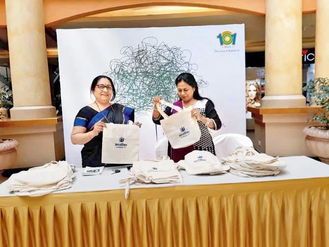 Ruchi Mane (left) shows the bags made by the women