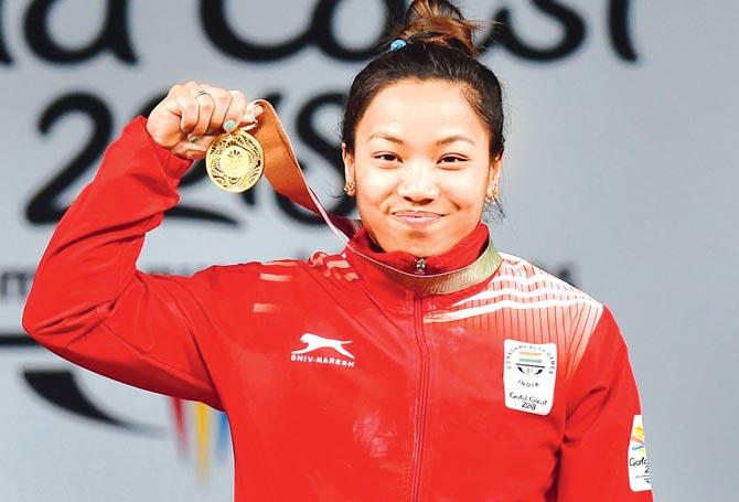 Saikhom Mirabai Chanu poses with her gold medal