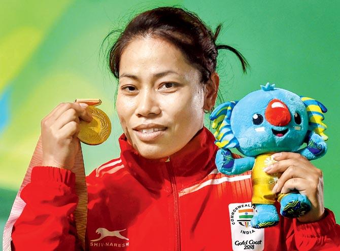 Sanjita Chanu with her gold medal. Pics/PTI