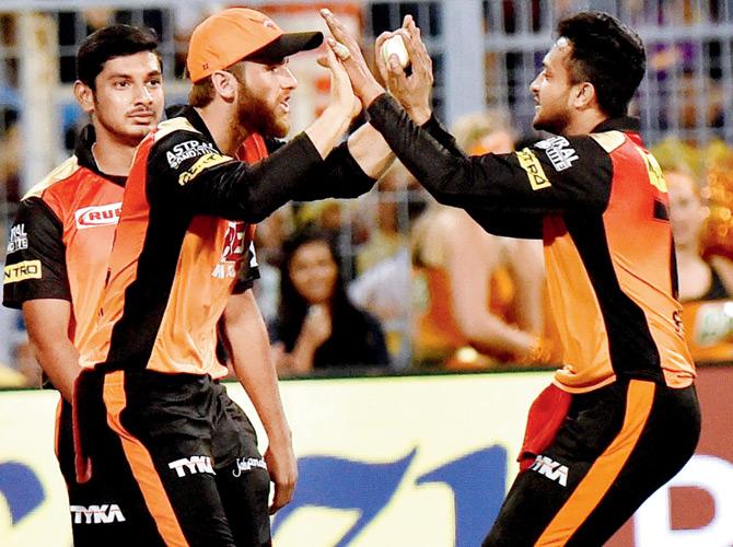 Hyderabad Shakib Al Hasan celebrates the fall of Kolkata wicket with skipper Kane Williamson. Pic/PTI