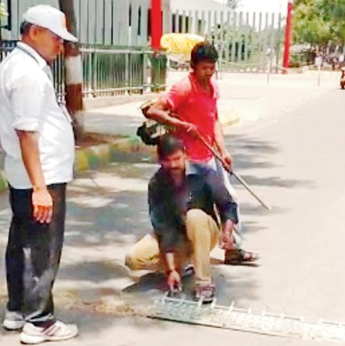 A worker removes the tyre killer installed in Pune
