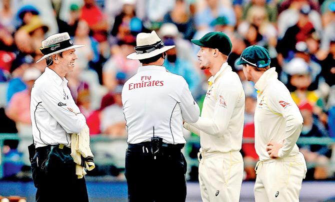 Umpires chat with Australia