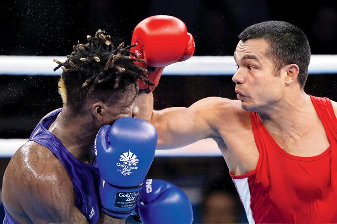 Vikas Krishan (right) fights Cameroon
