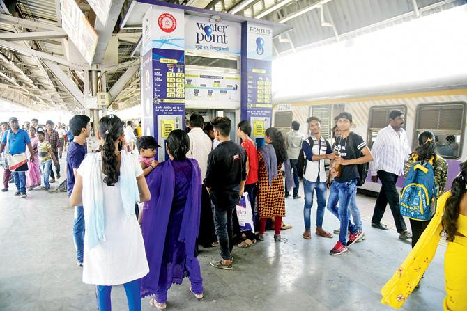 Many locals buy water from the water vending machines at Diva and other railway stations