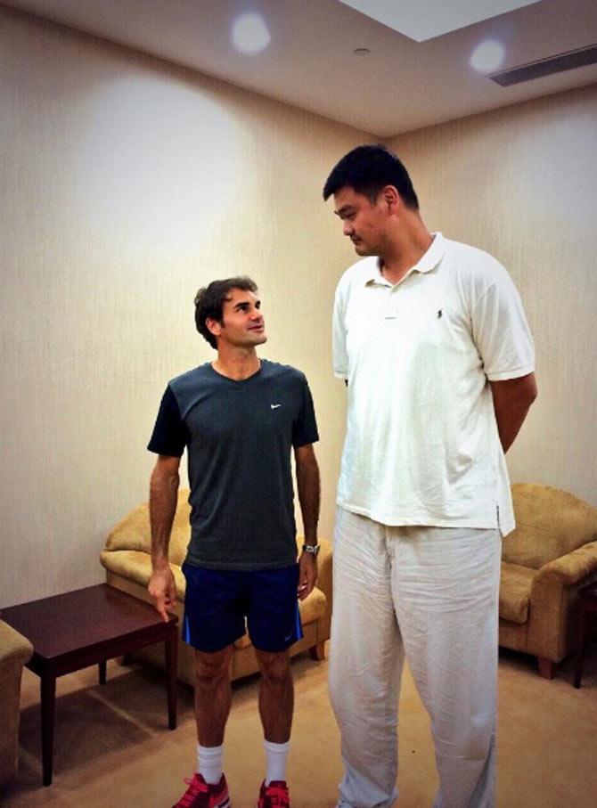 In this picture 6-foot, 1-inch Roger Federer dwarfed by 7-foot plus NBA star Yao Ming. Federer received an honorary doctorate awarded to him by his home university, the University of Basel. He received the title in recognition for his role in increasing the international reputation of Basel and Switzerland, and also his engagement for children in Africa through his charitable foundation
