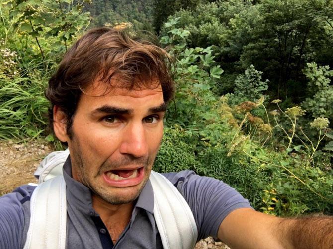 Roger Federer looks terrified of falling into the ditch behind him. He is known for nailing the selfie game in his social media posts. Apart from selfies Federer's all-court game and versatile style of play involve exceptional footwork and shot-making. Effective both as a base-liner and a volleyer, his apparent effortlessness and efficient movement on the court have made Federer highly popular among his fans